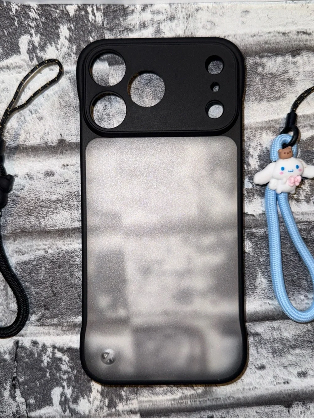 17 Pro Max Phone Case Matte Black featuring Kuromi and Cinnamoroll lanyards.